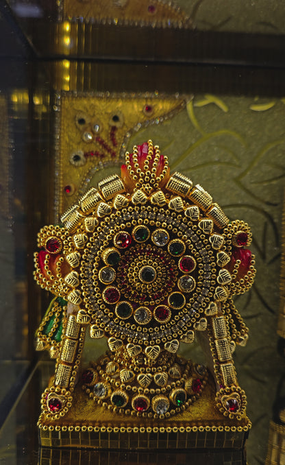 Shank Chakra with Balaji decorated with stones in transparent protective cabin