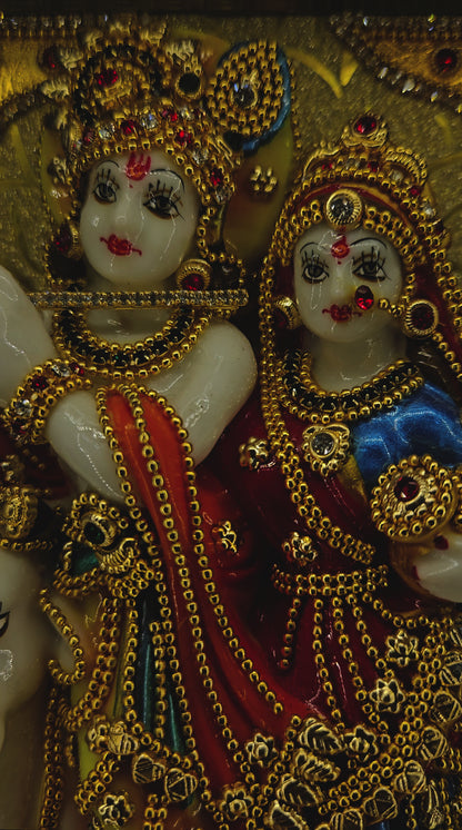 Radha Krishna attractive stones designed 24 carats gold Plated idol Statue showpiece in a transparent protective cabin