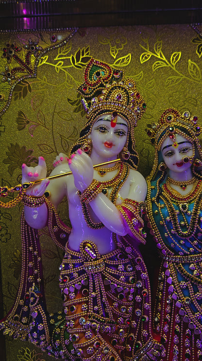 24 carats gold Plated radha Krishna Idol Statue Decorated with attractive stones in a transparent protective cabin with lights