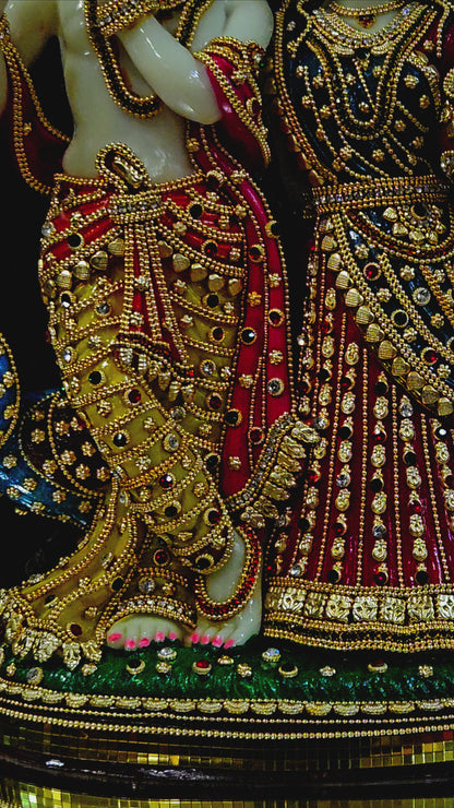 24carat gold Plated attractive Krishna Idol Decorated with stones in a transparent protective cabin