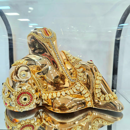 Lord Vinayaka murti 24carats gold Plated idol with attractive stones designed Statue in a transparent protective cabin