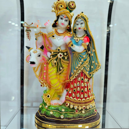 24 carats gold Plated radha Krishna Idol Decorated with attractive stones designed Statue showpiece in transparent protective cabin