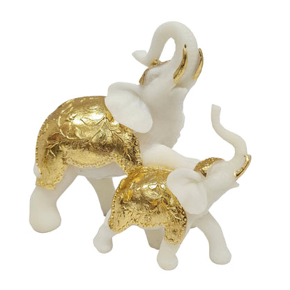Handcrafted white and gold elephant showpiece, often inspired by the GajaLaxmi symbol representing wealth and wisdom Showpiece Figurine