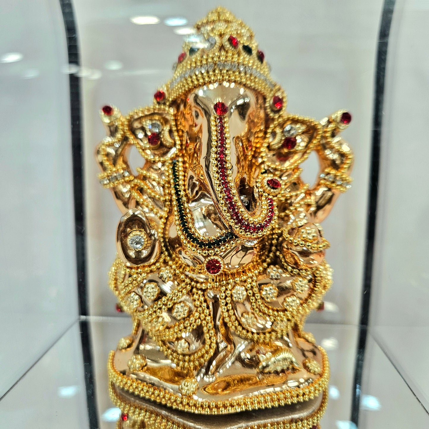 Lord vinayaka murti 24carats gold Plated idol Statue in a transparent protective cabin