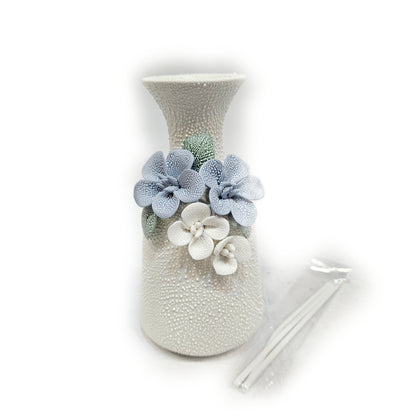 water droplets textured ceramic vase with light blue and white flowers vase