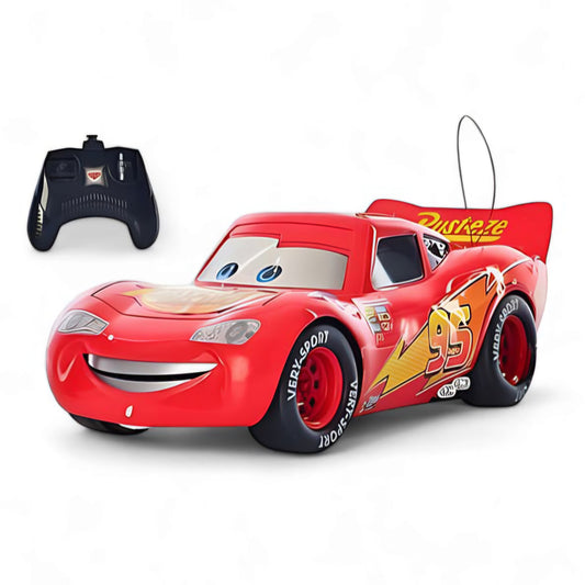 Red toy car with a smiley face and remote control on a white background