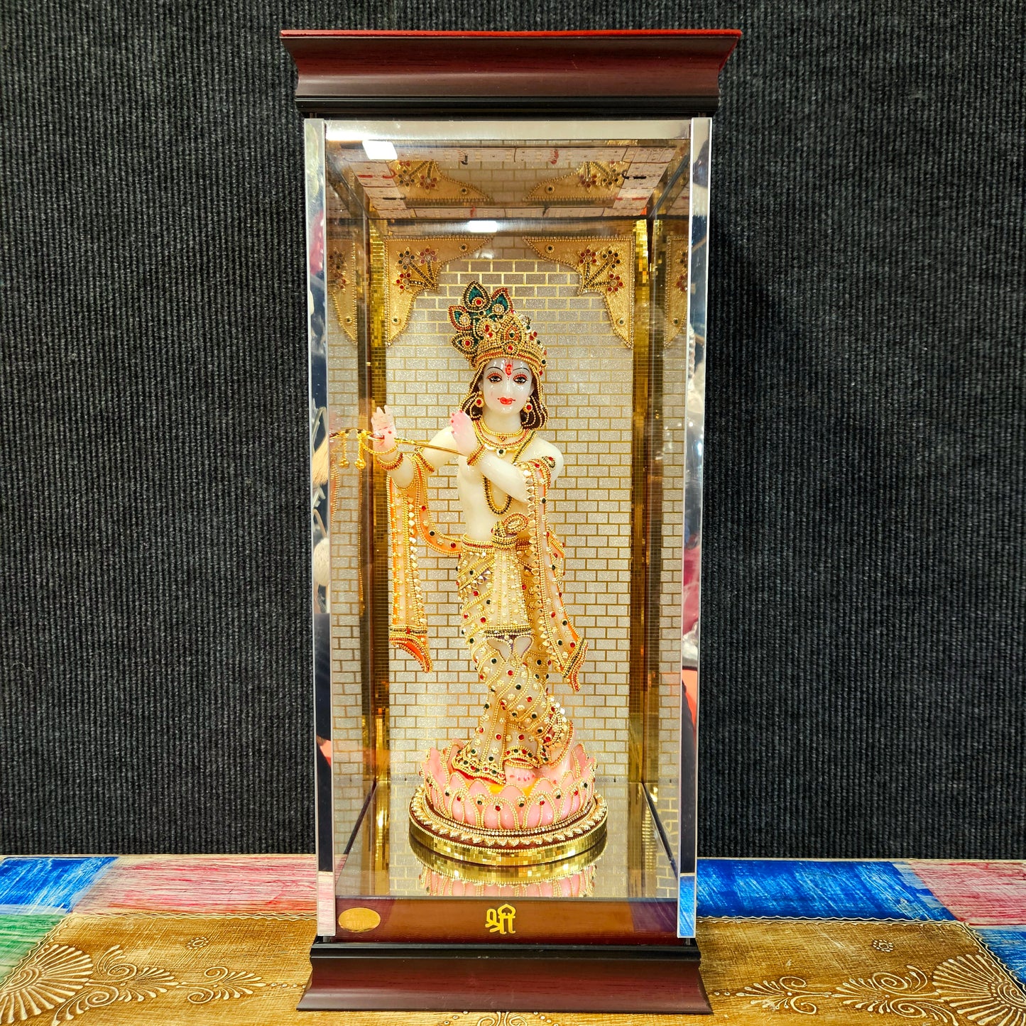 24carats gold Plated Krishna Statue idol Decorated with attractive stones in a transparent protective cabin