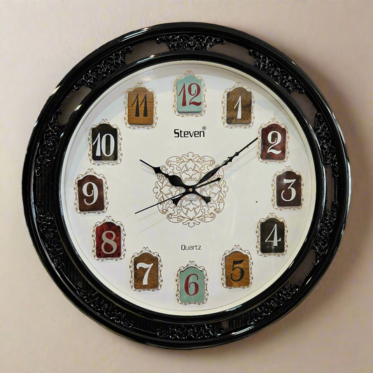 Wall clock with decorative black frame on a dark textured background