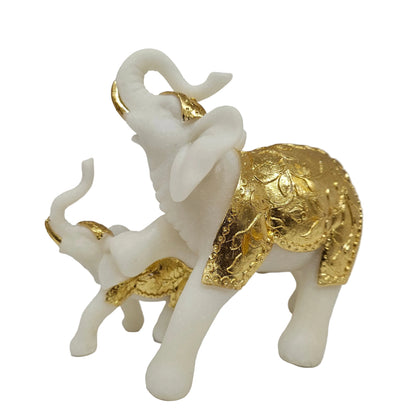Handcrafted white and gold elephant showpiece, often inspired by the GajaLaxmi symbol representing wealth and wisdom Showpiece Figurine