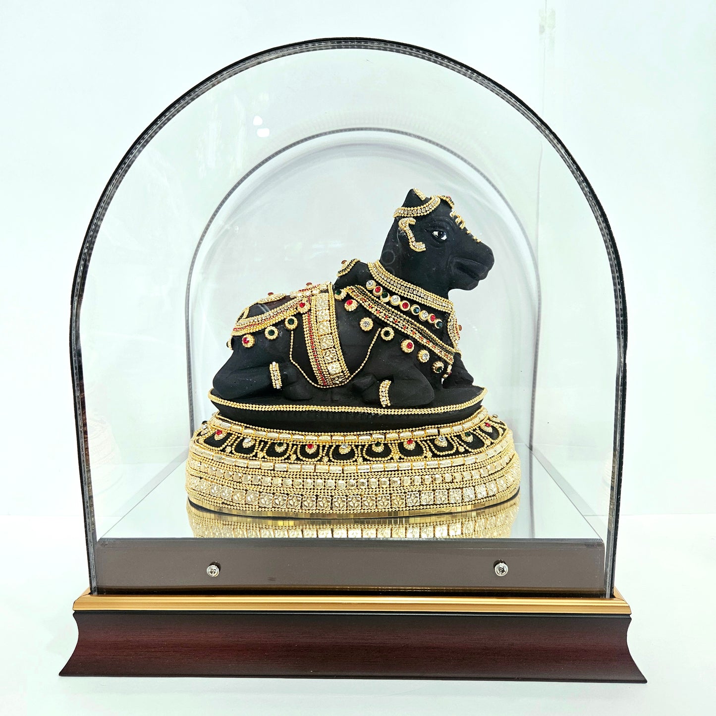 24 carats gold Plated Nandi statue idol Decorated with attractive stones in a transparent protective cabin