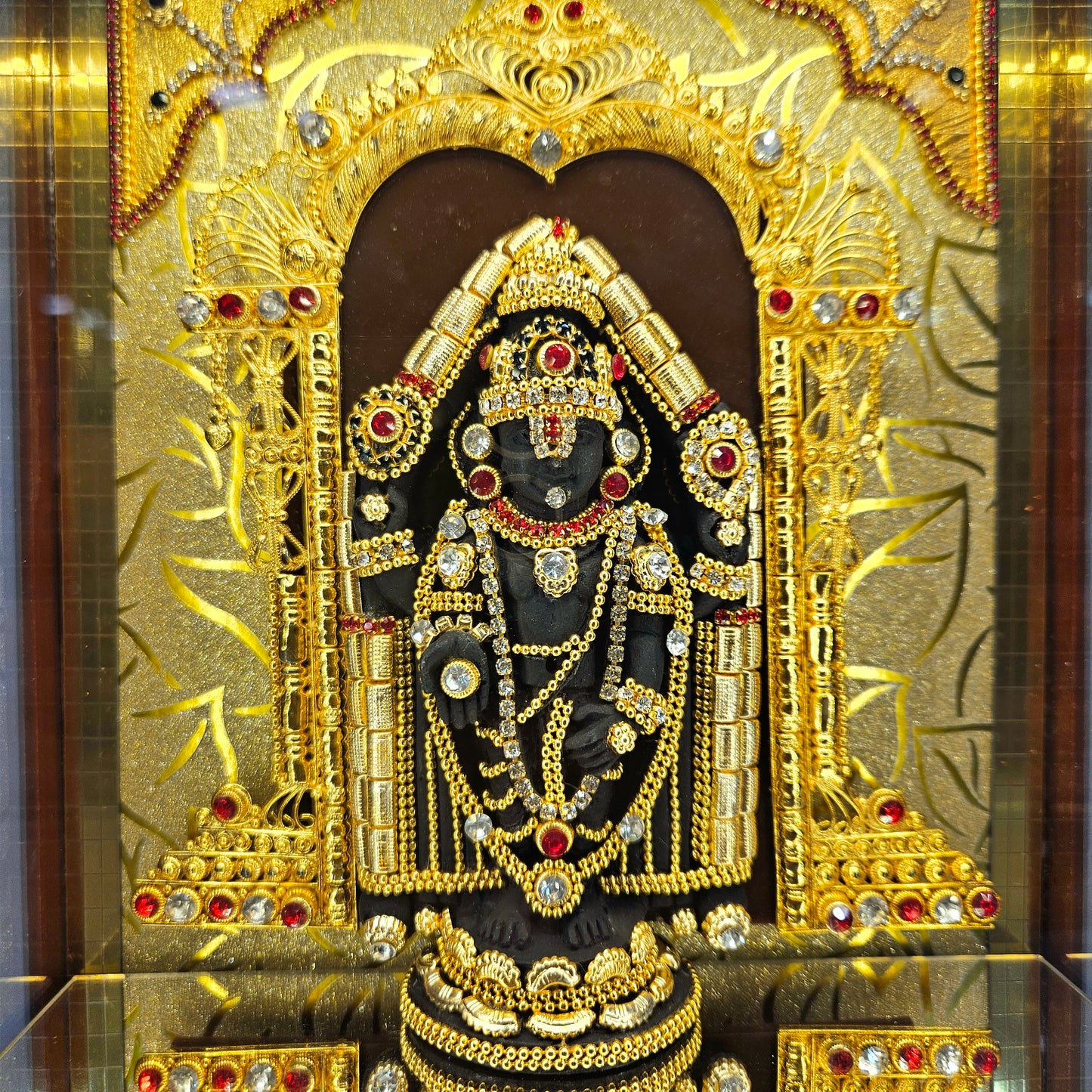 Lord Balaji decorated with attractive stones 24 carats gold Plated idol Statue in a transparent protective cabin