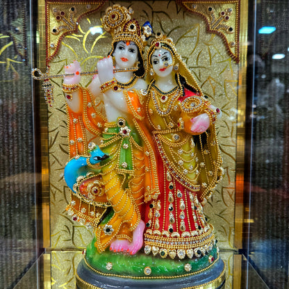24 carat gold Plated radha Krishna Idol Statue Decorated with attractive stones design transparent protective cabin
