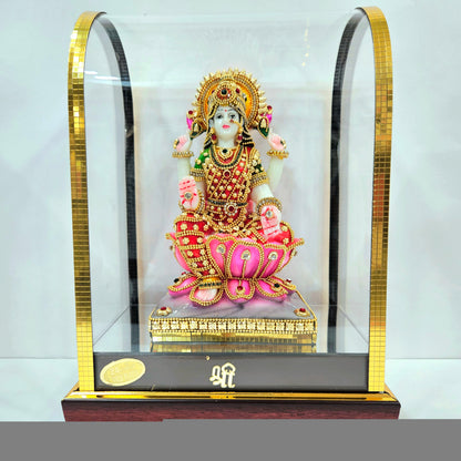 Lakshmi mata 24carats gold Plated idol Decorated with attractive stones in a transparent protective cabin