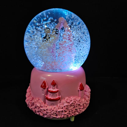 Beautiful married couple with Castle themed multi colour lighting snow Globe