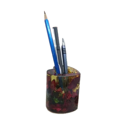 Resin pen stand features embedded red rose petals and gold flakes, arranged in a heart shape