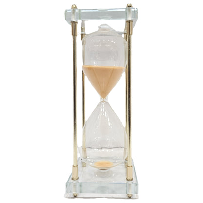 Gold hourglass Home Sleek metallic structure and clear glass filled with beige sand Showpiece
