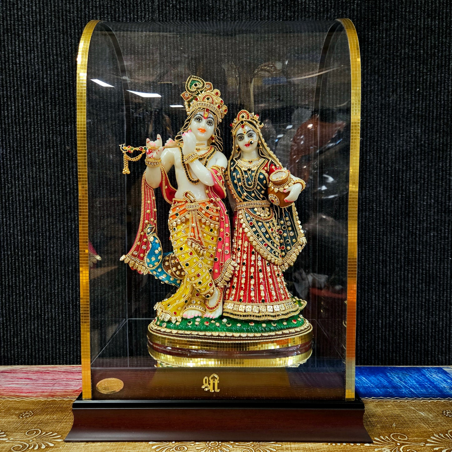24carat gold Plated attractive Krishna Idol Decorated with stones in a transparent protective cabin