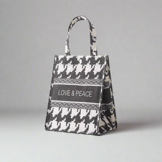 Tote bag with houndstooth pattern and 'LOVE & PEACE' text on a white background