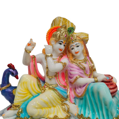 Polyresin Radha Krishna murti features a colorful pink and yellow attire with gold-toned detailing idol Statue showpiece Figurine