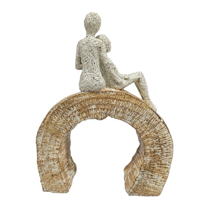 Decorative showpiece love Couple textured figure perched a top a textured, arched base