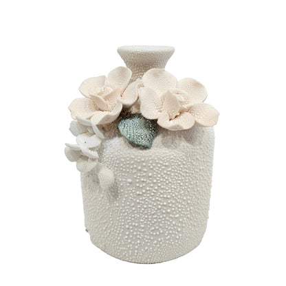 water droplets textured ceramic vase with light blue and white flowers vase