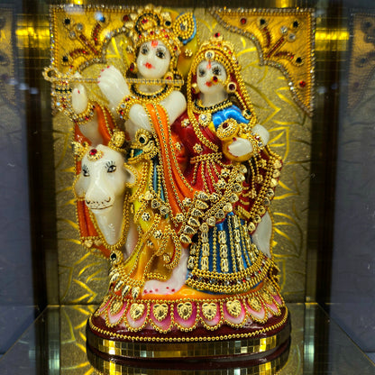 Radha Krishna attractive stones designed 24 carats gold Plated idol Statue showpiece in a transparent protective cabin