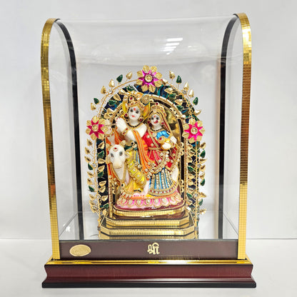 24 carats gold radha Krishna Idol in transparent protective cabin with attractive Leaves&Flowers metal arch,decorative stones designed Statue Showpiece