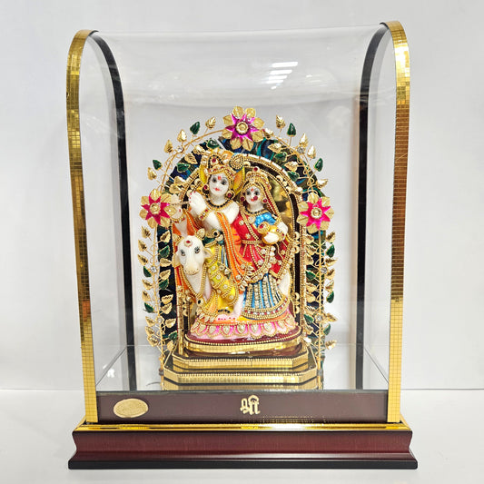 24 carats gold radha Krishna Idol in transparent protective cabin with attractive Leaves&Flowers metal arch,decorative stones designed Statue Showpiece