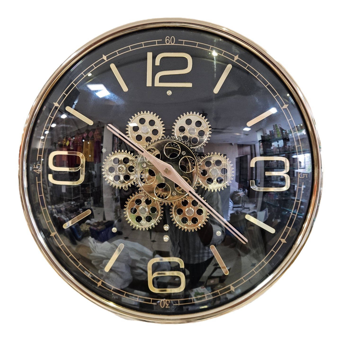 Decorative wall clock with gear design on a white background