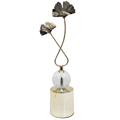 Gold-tone metal ginkgo leaf sculpture features a unique central crystal ball accent