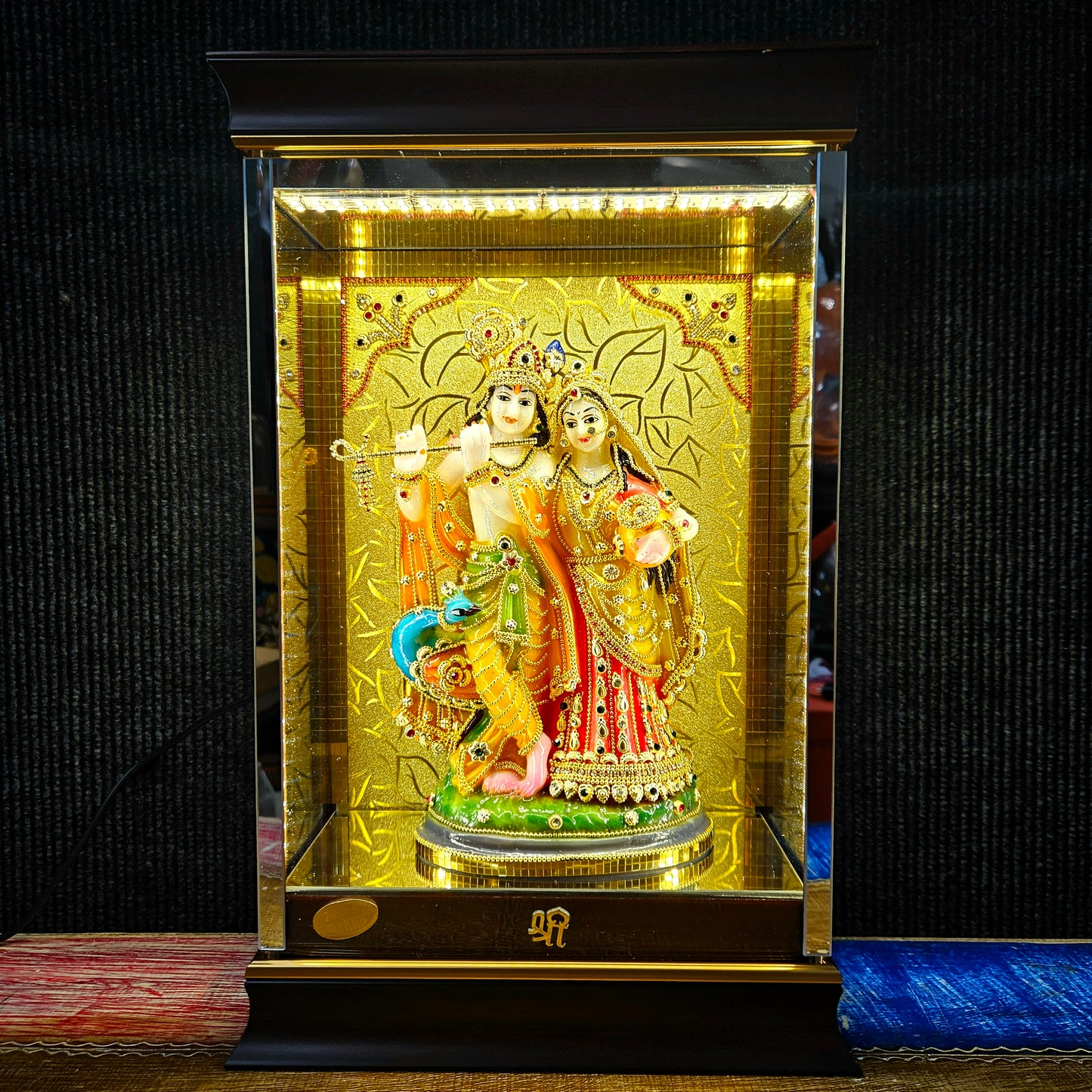24 carat gold Plated radha Krishna Idol Statue Decorated with attractive stones design transparent protective cabin