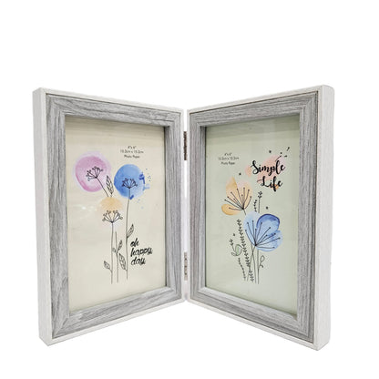 White, rustic-style foldable double photo frame features a weathered wood grain finish and hinges for tabletop