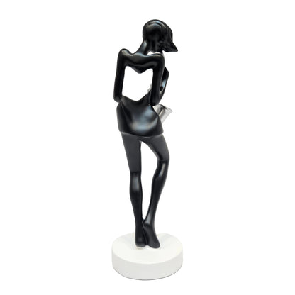 polyresin statue depicts a saxophone player in a black and silver finish, standing approximately tall on a white base
