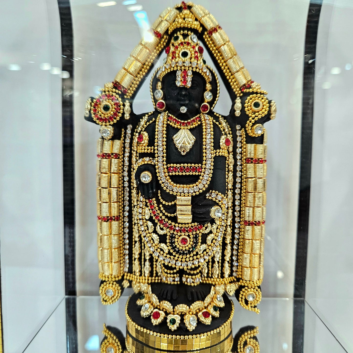 24 carats gold Plated Balaji Idol Statue Decorated with attractive stones designed in a transparent protective cabin