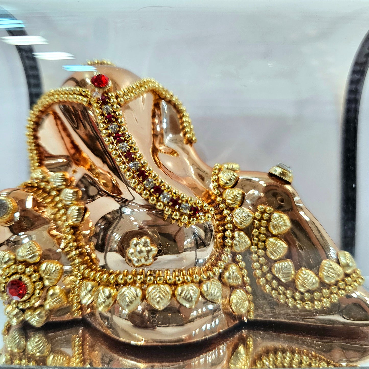 Lord vinayaka murti in sitting posture 24carats gold Plated idol Statue in a transparent protective cabin