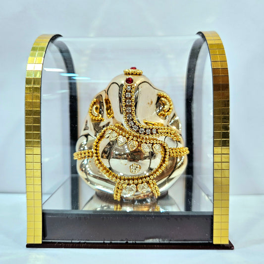 Lord vinayaka murti in a attractive look Decorated with stones designed in a transparent protective cabin