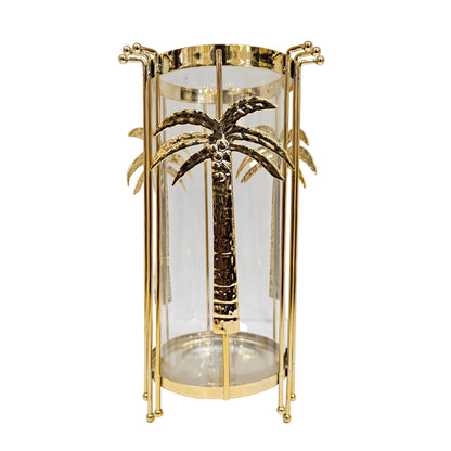 Gold metal hurricane candle holder from Jenny Robert Exclusive Décor a glass insert adorned with palm tree