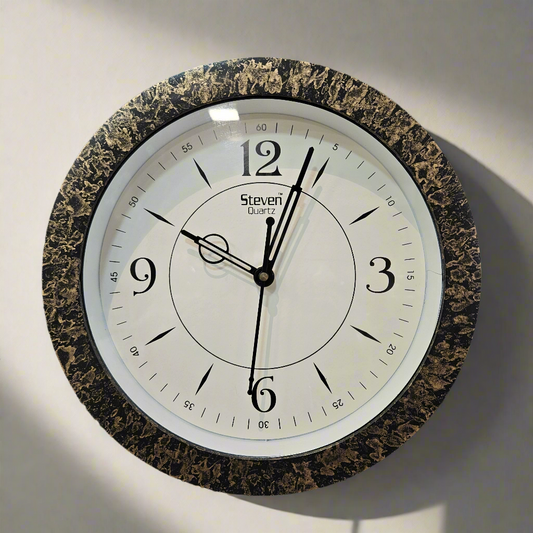 Round wall clock with marble-like frame on a dark textured background