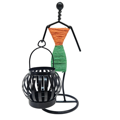 Retro Style Candlestick Figurine features a handcrafted metal silhouette holding a small black lantern Showpiece