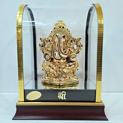 Lord vinayaka 24 carats gold Plated idol Decorated with attractive stones in a transparent protective cabin
