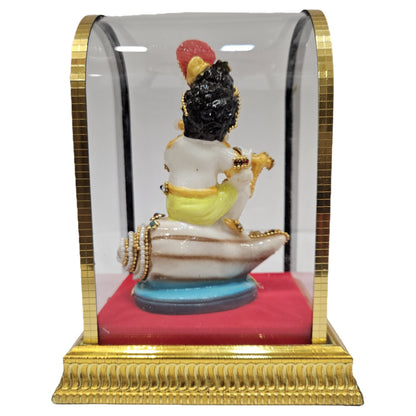 Handcrafted Baby Krishna "Makhan Chor" idol made of polyresin and enclosed in a glass display cabin case