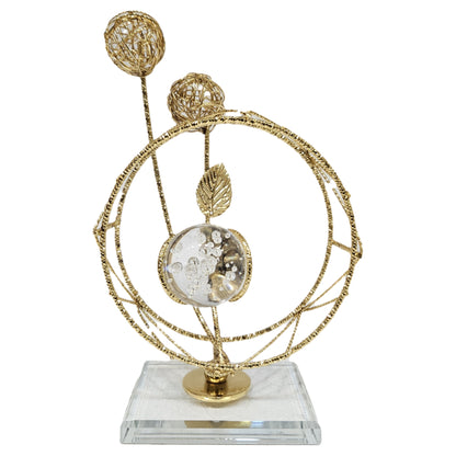 Modern gold metal and crystal ball table showpiece serves as a contemporary luxury decorative accent