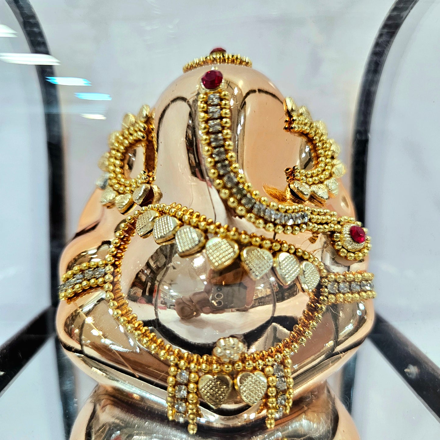 24carats gold Plated vinayaka idol Statue Decorated with attractive stones in transparent protective cabin