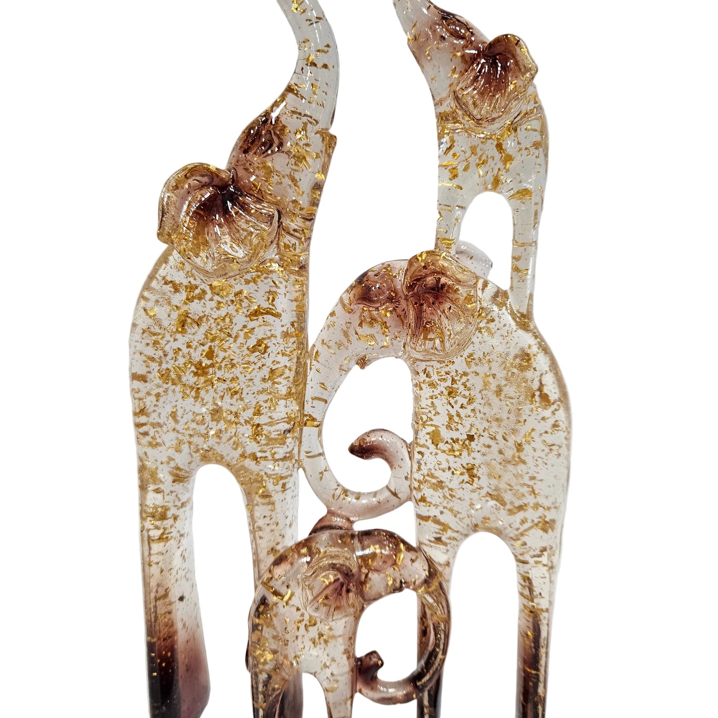 Glass sculpture of a four family elephants detailed with gold leaf flakes and brown tips Showpiece Figurine