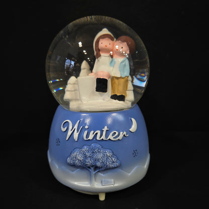 Beautiful love Couple with winter themed multi colour lighting snow Globe