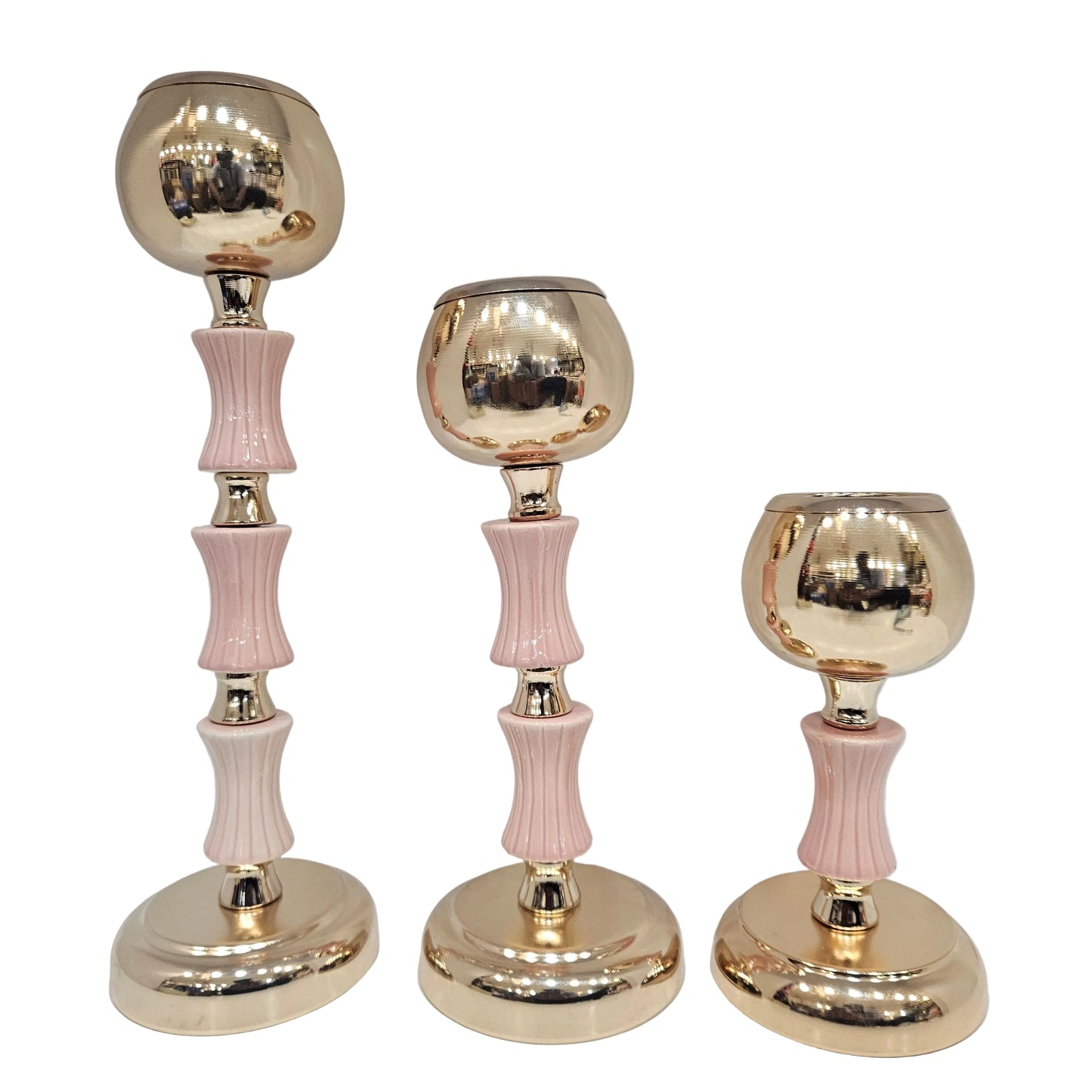 Gold and pink decorative candle holders feature a classic polished finish and are designed to securely hold tea lights
