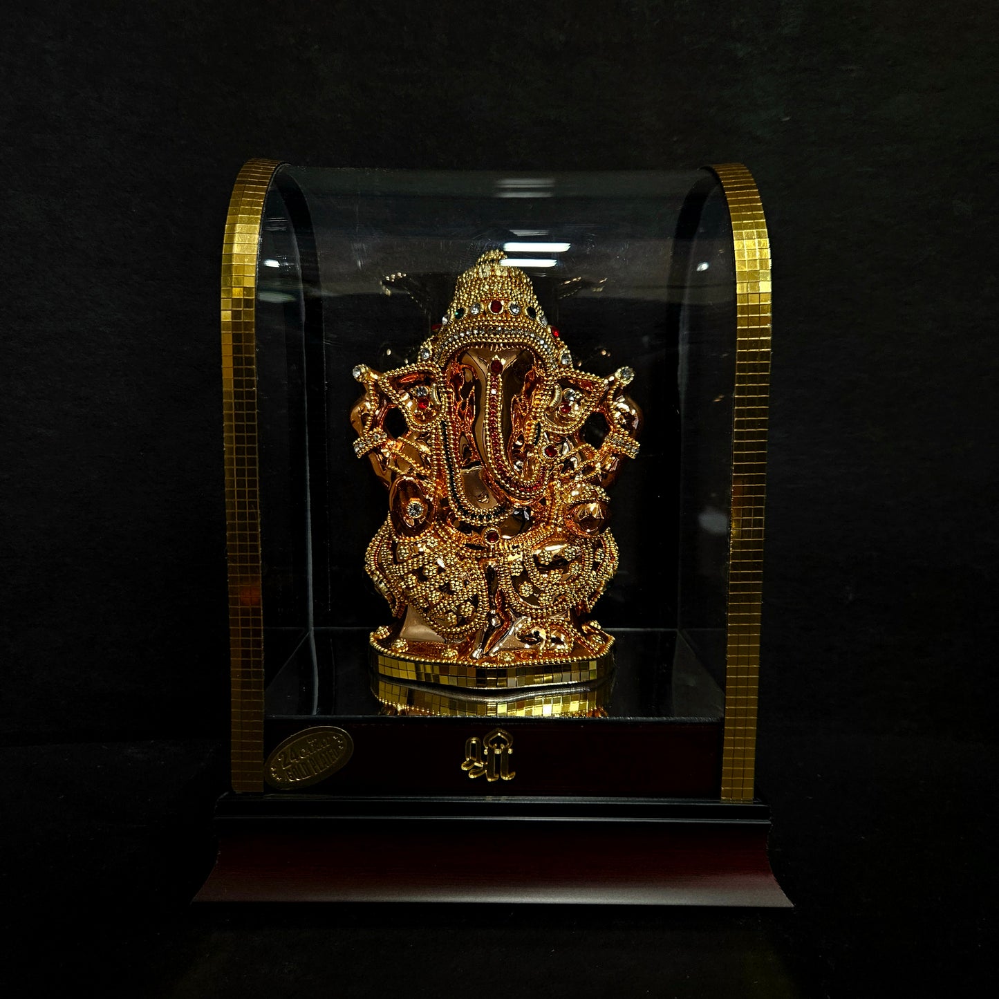 24 carat gold Plated vinayaka idol with stone designer,transparent protective cabin