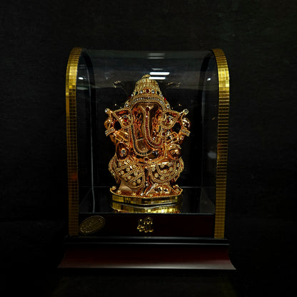 24 carat gold Plated vinayaka idol with stone designer,transparent protective cabin