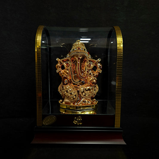 24 carat gold Plated vinayaka idol with stone designer,transparent protective cabin