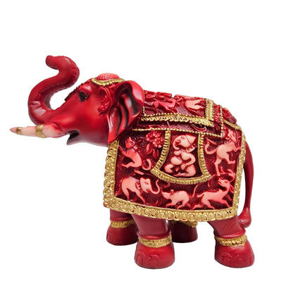 Red and golden fiber elephant statue featuring intricate carvings on the saddle for interior decor Showpiece Figurine